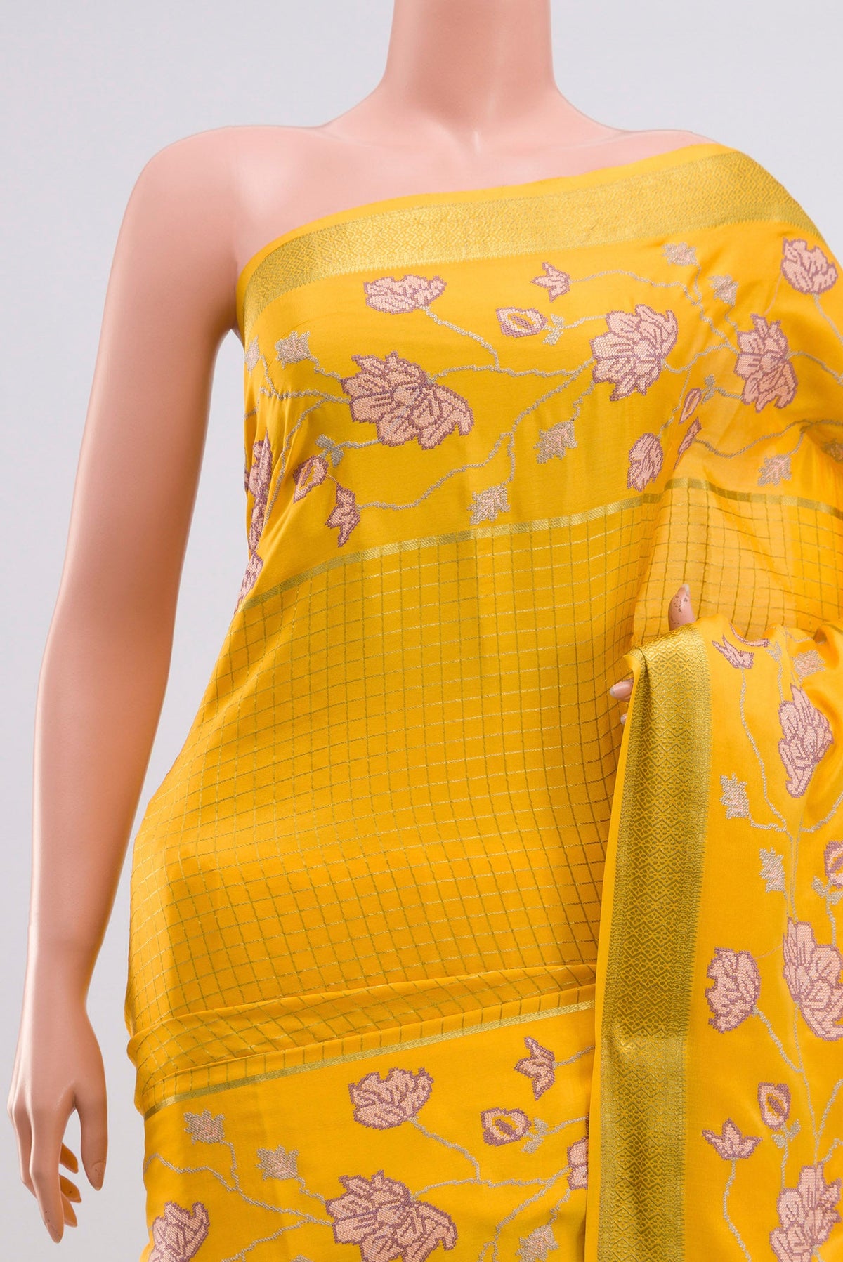 Border image of Yellow Crepe Saree with Checked design on the body and Zari Border. 