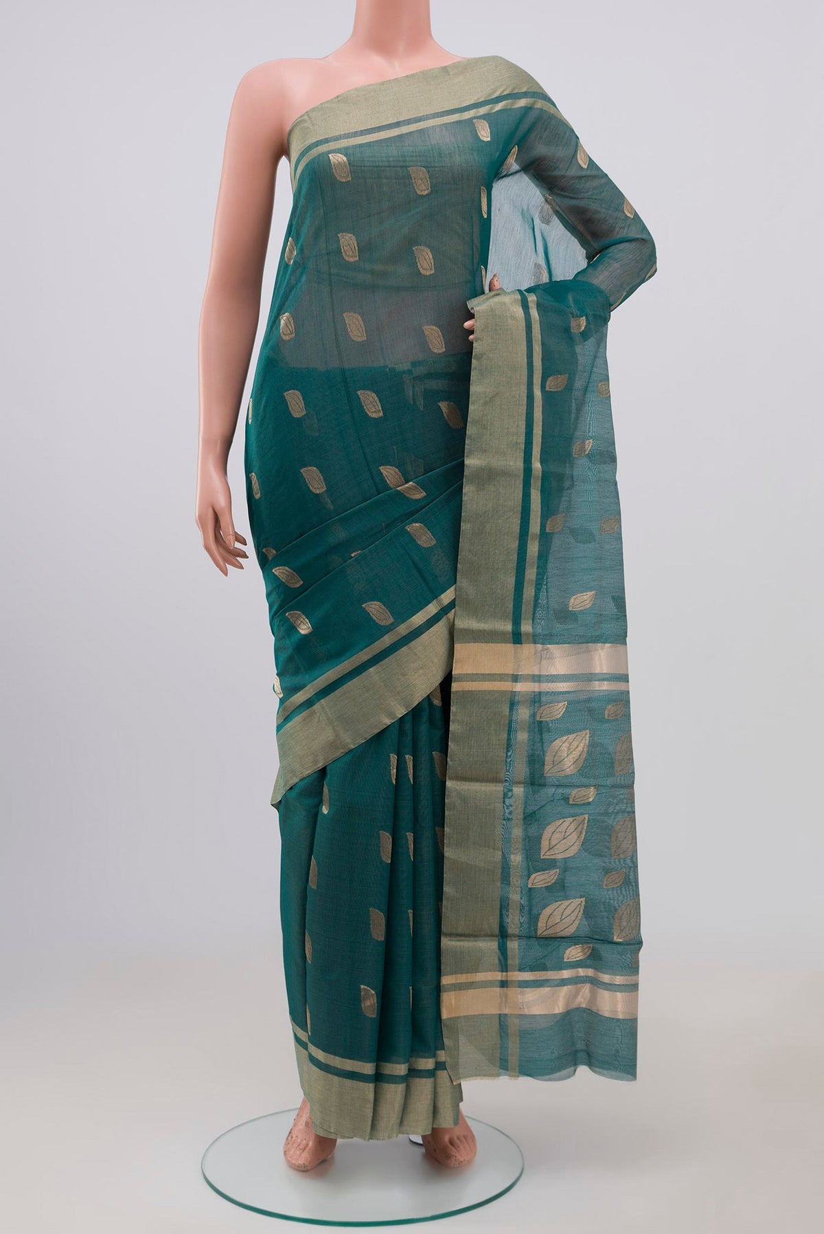 Green Chanderi Silk Cotton Saree with Zari Butta on the body and Zari Border.  displayed on a mannequin