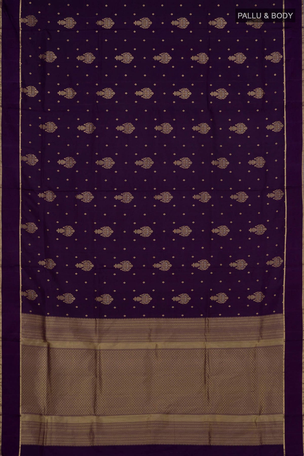 Flat view of Purple Soft Silk Saree with Zari Butta on the body and Thin Zari Line. 