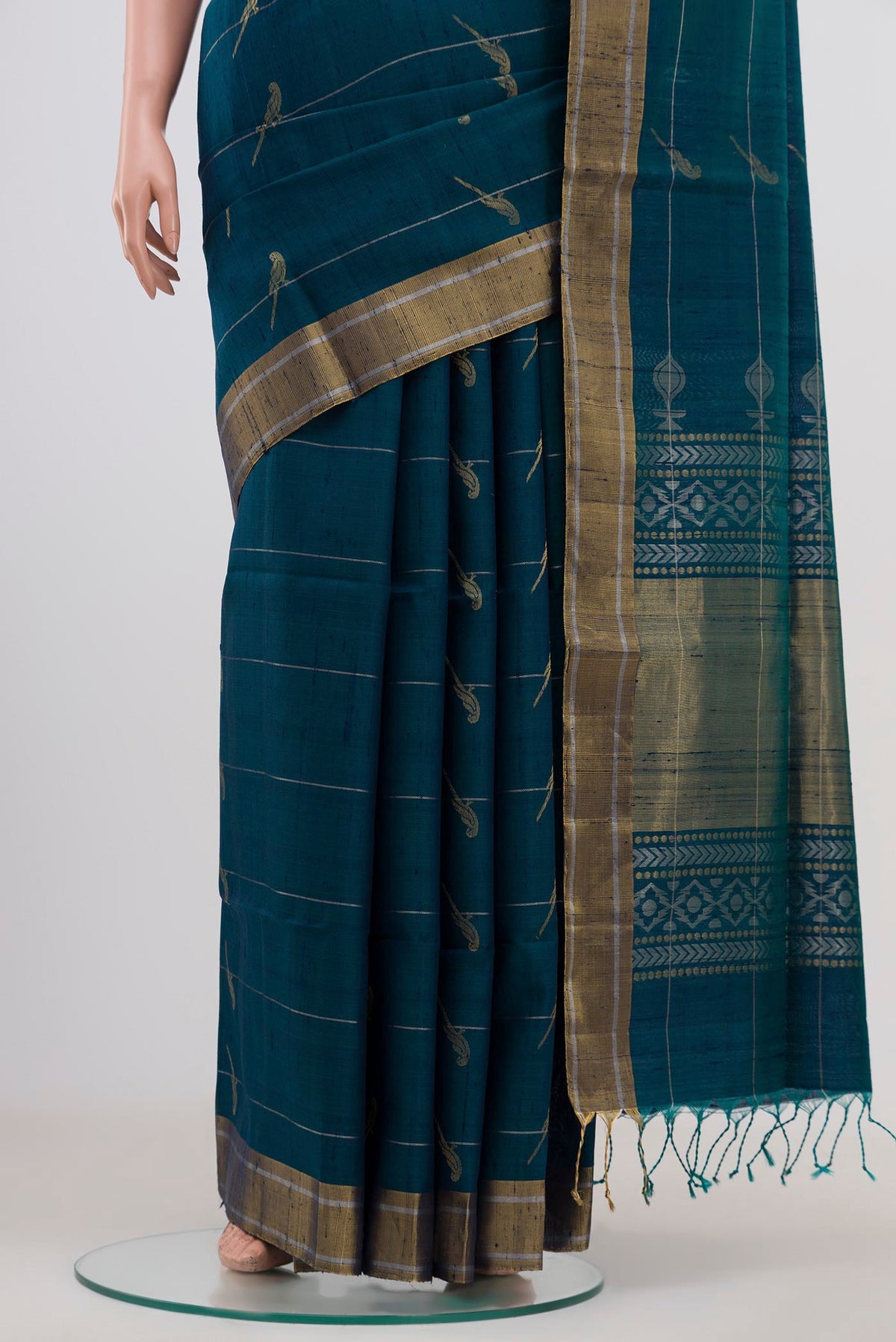 Pleats and pallu of Peacock Blue Soft Silk Saree with Zari Butta on the body and Zari Border. 