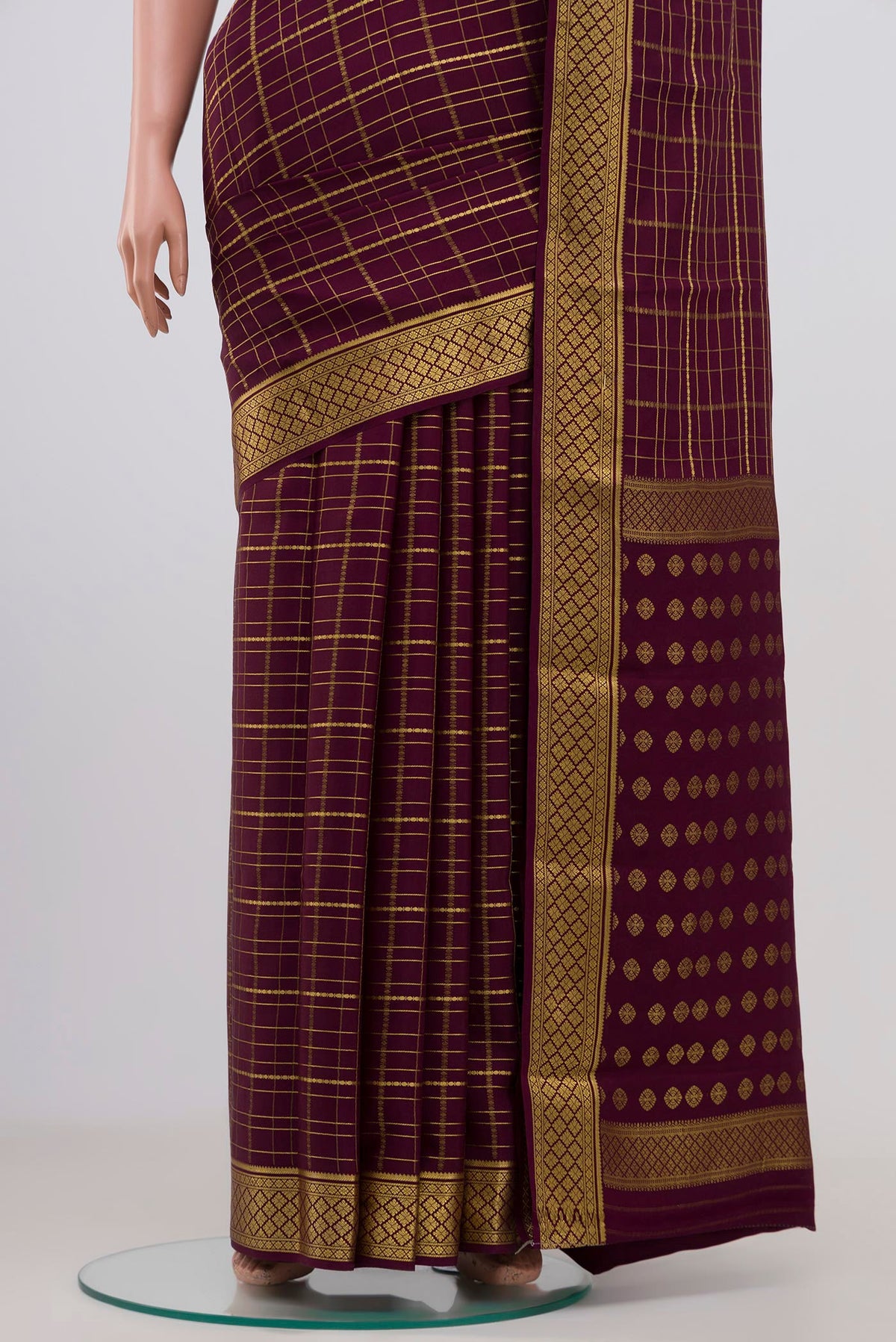 Pleats and pallu of Purple Mysore Crepe Saree with Checked design on the body and Zari Border. 