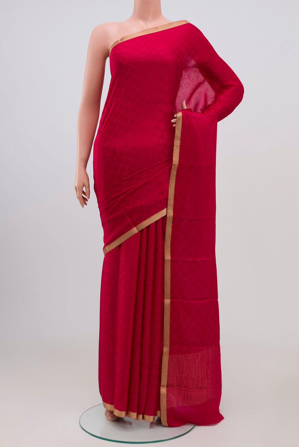 Pink Crepe Saree with Jacquard design on the body and Zari Border.  displayed on a mannequin