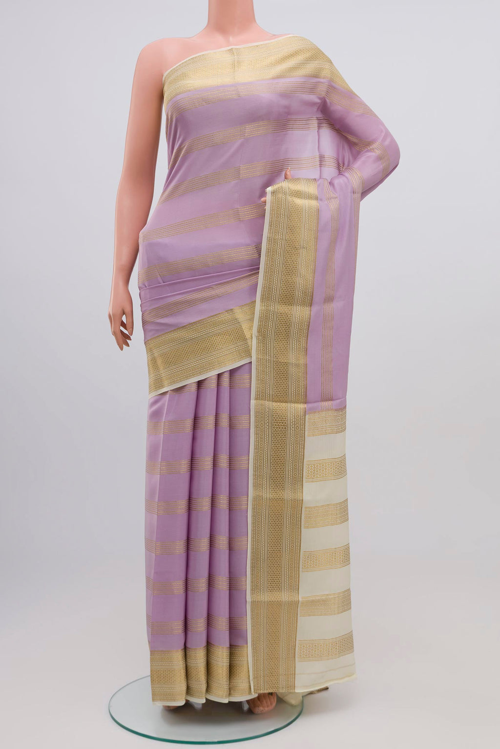 Lavender Mysore Crepe Saree with Stripes on the body and Zari Border.  displayed on a mannequin