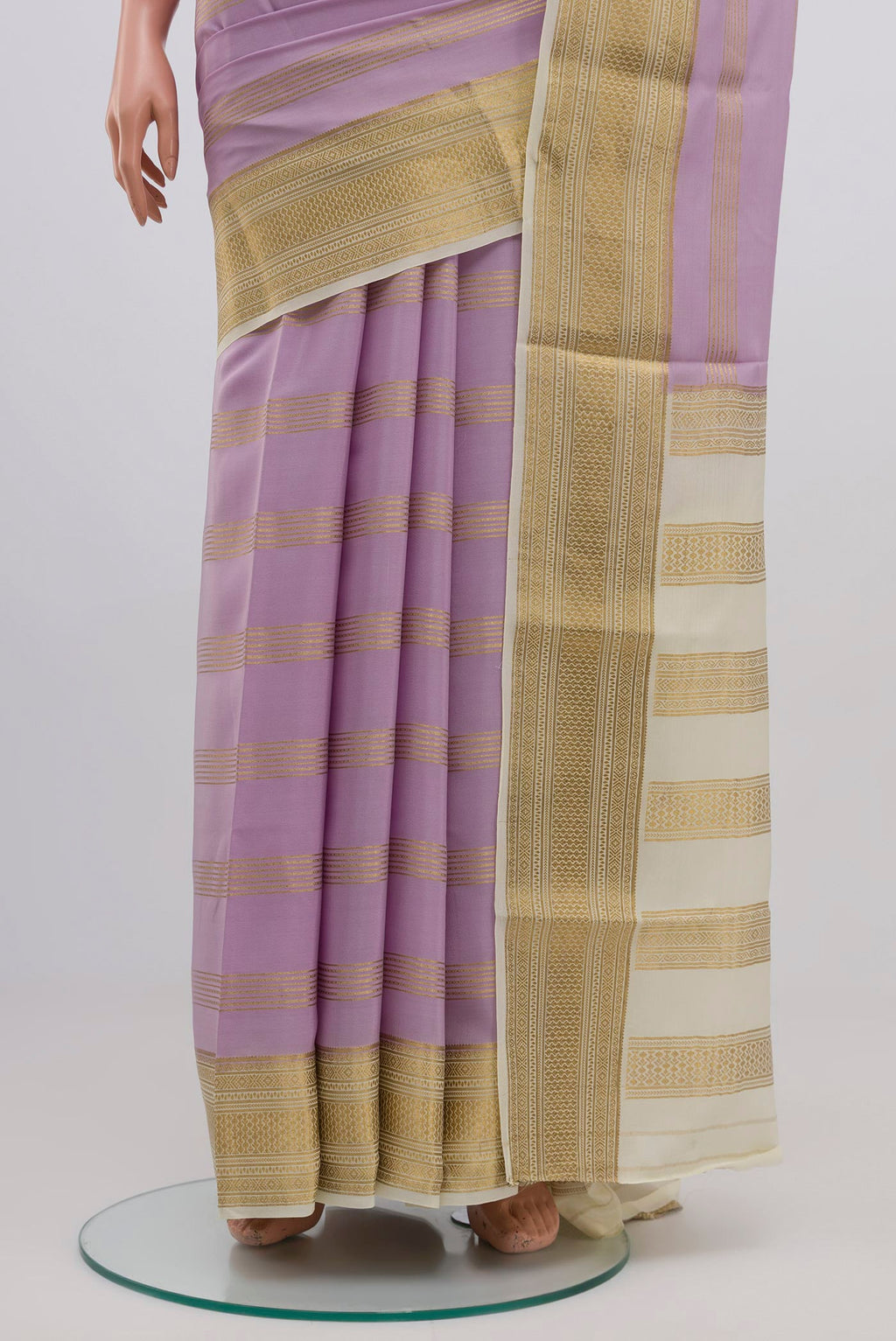 Pleats and pallu of Lavender Mysore Crepe Saree with Stripes on the body and Zari Border. 