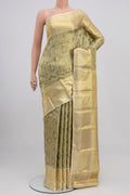 Green Kanchipuram Saree with Zari Brocade on the body and Zari Border.  displayed on a mannequin