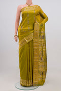 Green Baluchari Silk Saree with Zari Butta on the body and Zari Border.  displayed on a mannequin