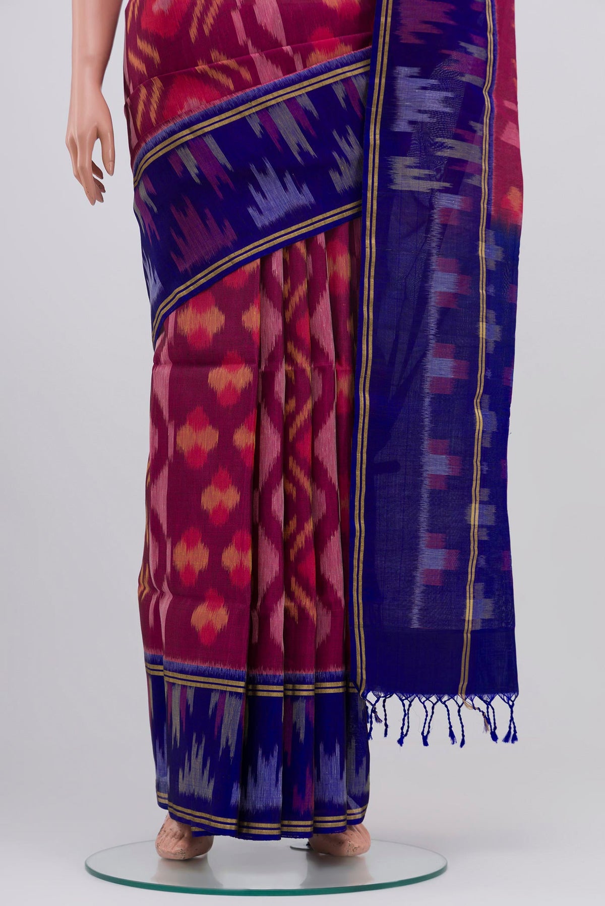 Pleats and pallu of Purple Soft Silk Saree with Ikat Print on the body and Ikat Border. 