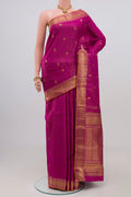 Magenta Kanjivaram Silk Saree with Zari Butta on the body and Zari Border.  displayed on a mannequin