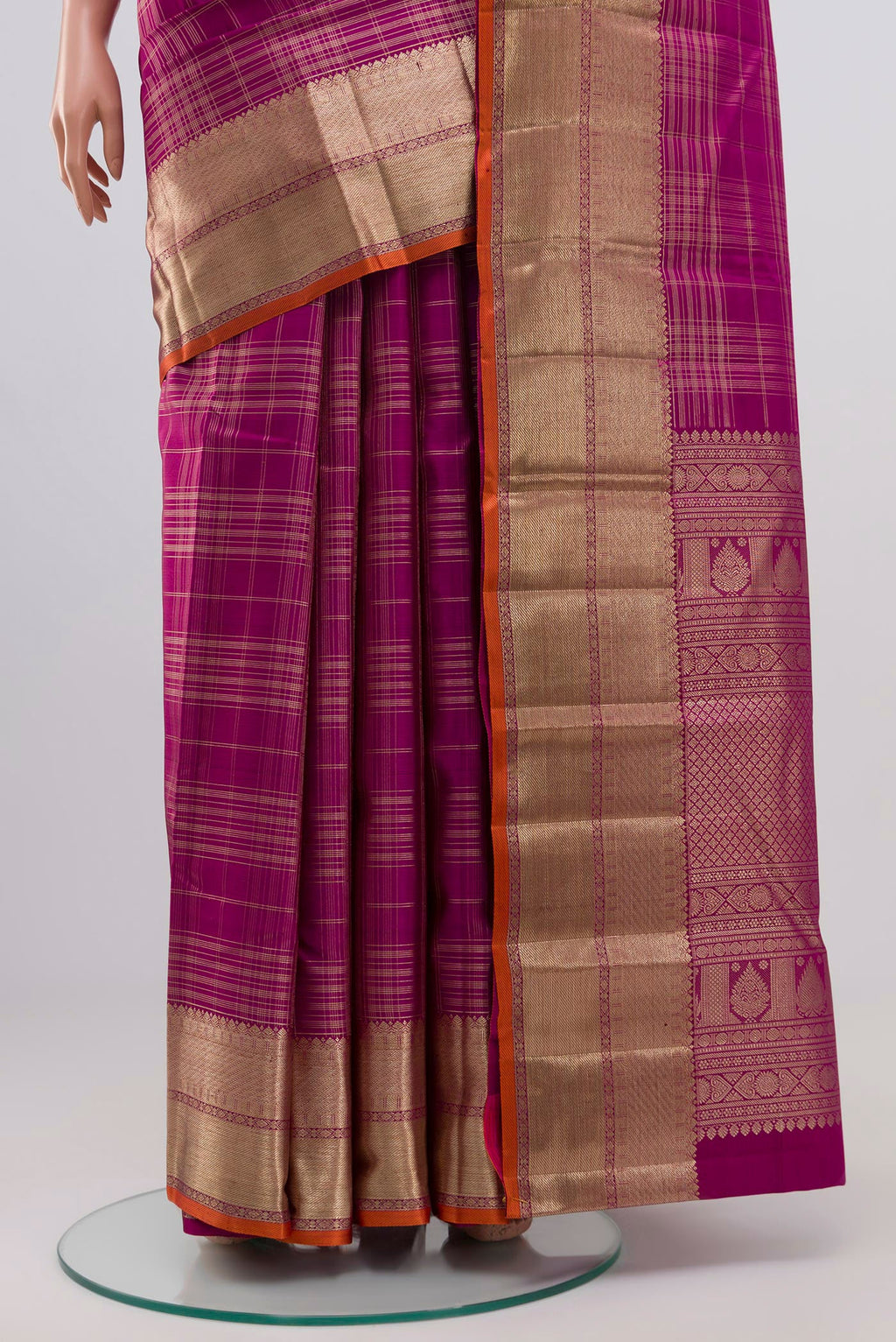 Pleats and pallu of Purple Kanchipuram Silk Saree with Checked design on the body and Zari Border. 