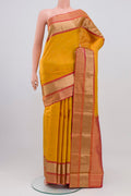 Yellow Kanchipuram Saree with Zari Butta on the body and Zari Border.  displayed on a mannequin