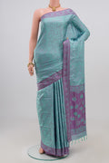 Blue Soft Silk Saree with Jacquard design on the body and Thread Border.  displayed on a mannequin