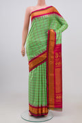 Green Gadwal Silk Saree with Zari Butta on the body and Zari Border.  displayed on a mannequin