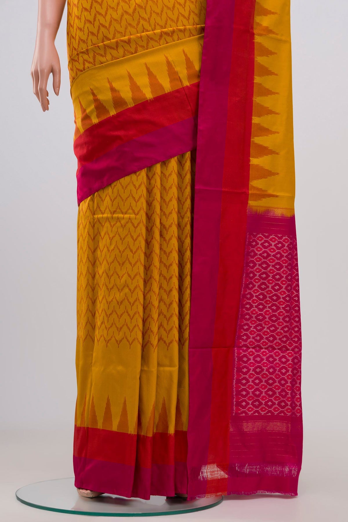 Pleats and pallu of Mustard Pochampally Silk Saree with Ikat Print on the body and Plain Border. 