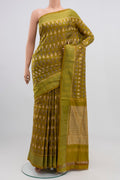Green Pochampally Silk Saree with Ikat Print on the body and Zari Border.  displayed on a mannequin