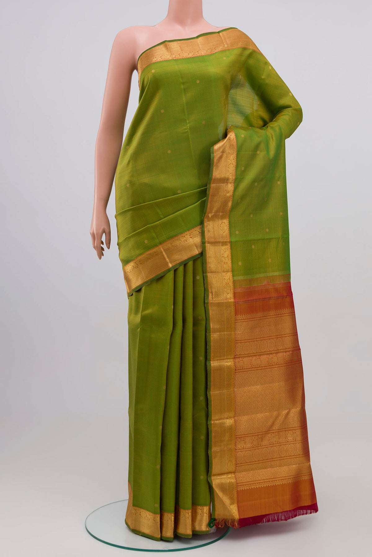 Pure Silk Pure Zari Light Green Kanjivaram Saree with Zari Butta on the body and Zari Border.  displayed on a mannequin