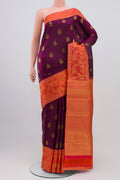 Purple Kanjivaram Saree with Zari Butta on the body and Fancy Border.  displayed on a mannequin