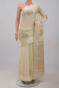 Cream Crepe Saree with Zari Butta on the body and Thin Zari Line.  displayed on a mannequin