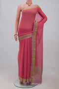 Peach Chiffon Saree with Plain Body and Zari Border.  displayed on a mannequin