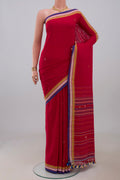 Red Assam Cotton Saree with Thread Butta on the body and Thread Border.  displayed on a mannequin