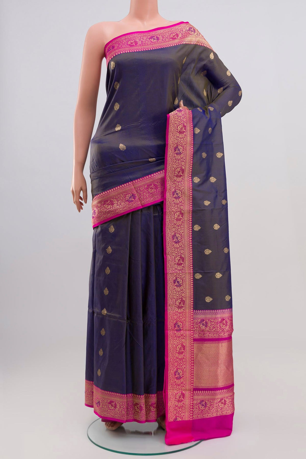 Blue Grey Banarasi Katan Silk Saree with Zari Butta on the body and Zari Border.  displayed on a mannequin