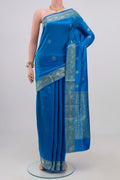 Royal Blue Banarasi Katan Silk Saree with Zari Butta on the body and Zari Border.  displayed on a mannequin