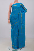 Blue Mysore Crepe Saree with Zari Butta on the body and Plain Border.  displayed on a mannequin