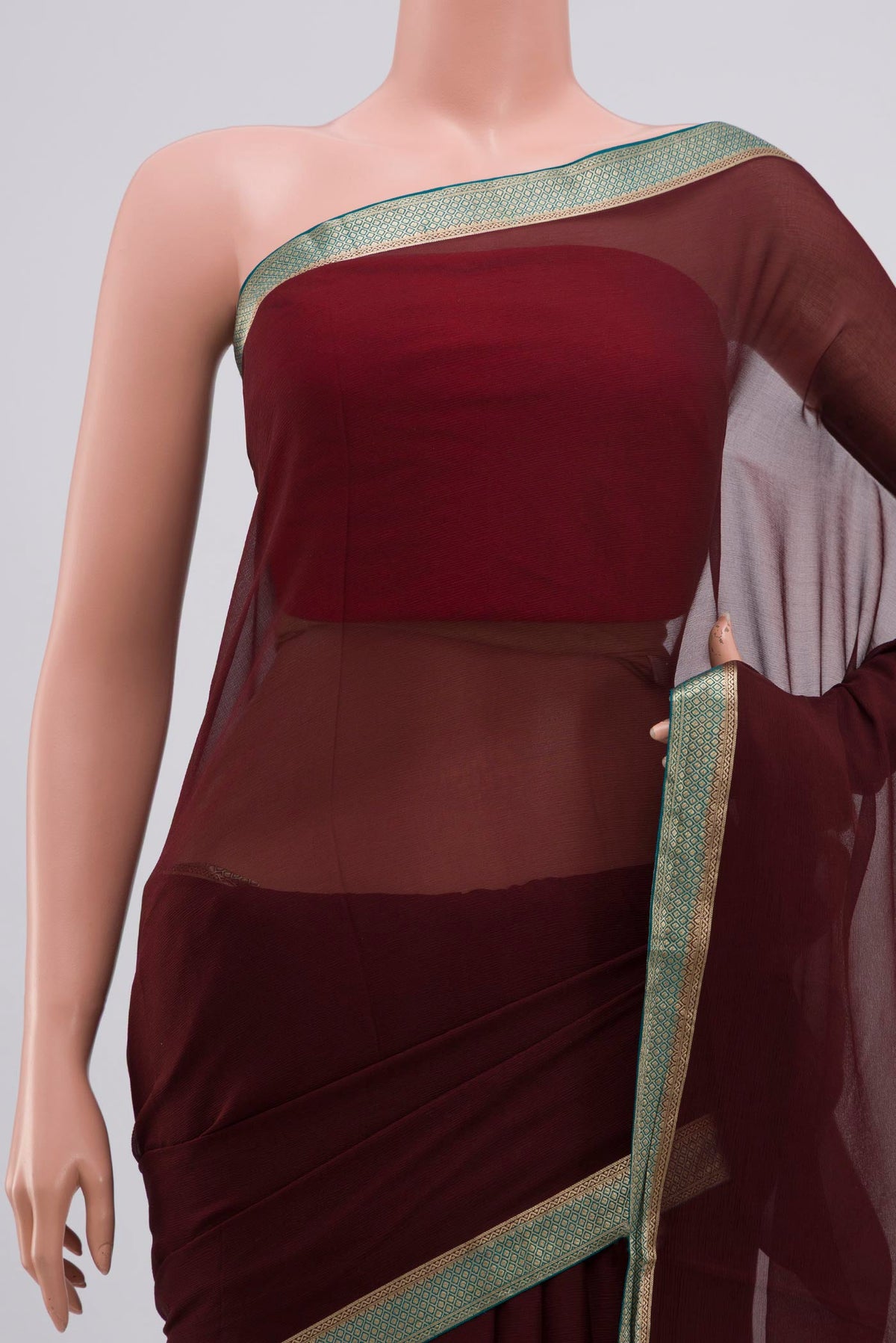 Border image of Brown Chiffon Saree with Plain Body and Zari Border. 