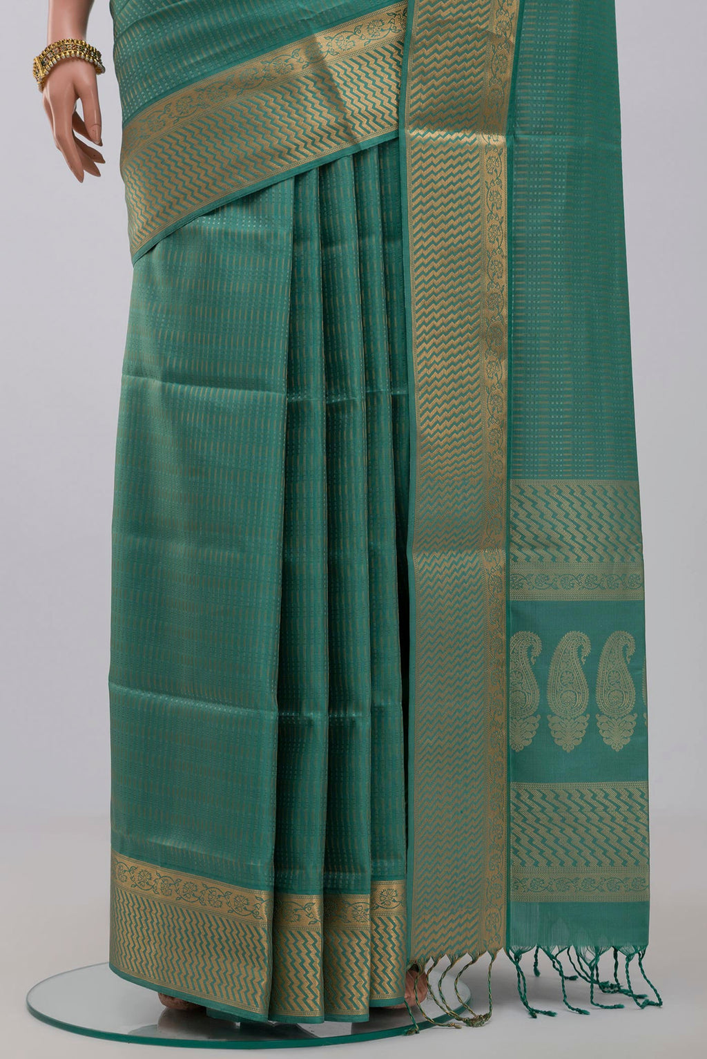 Pleats and pallu of Green Soft Silk Saree with Jacquard design on the body and Zari Border. 