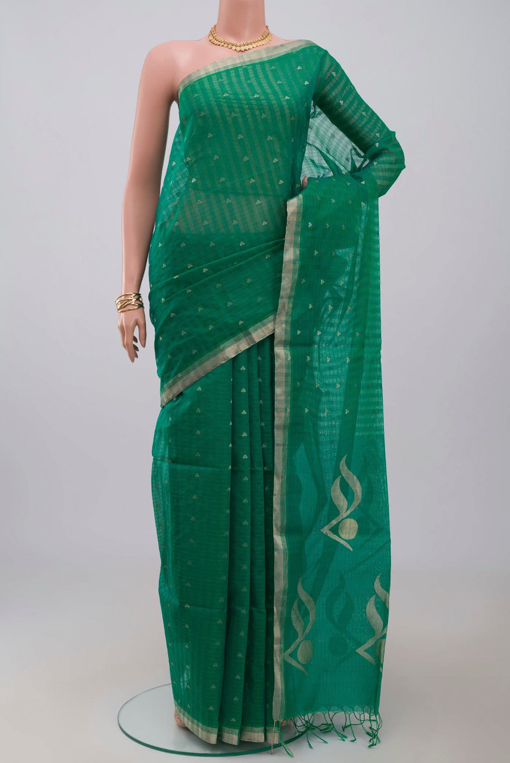 Green Silk Cotton Saree with Zari Butta on the body and Thin Zari Line.  displayed on a mannequin