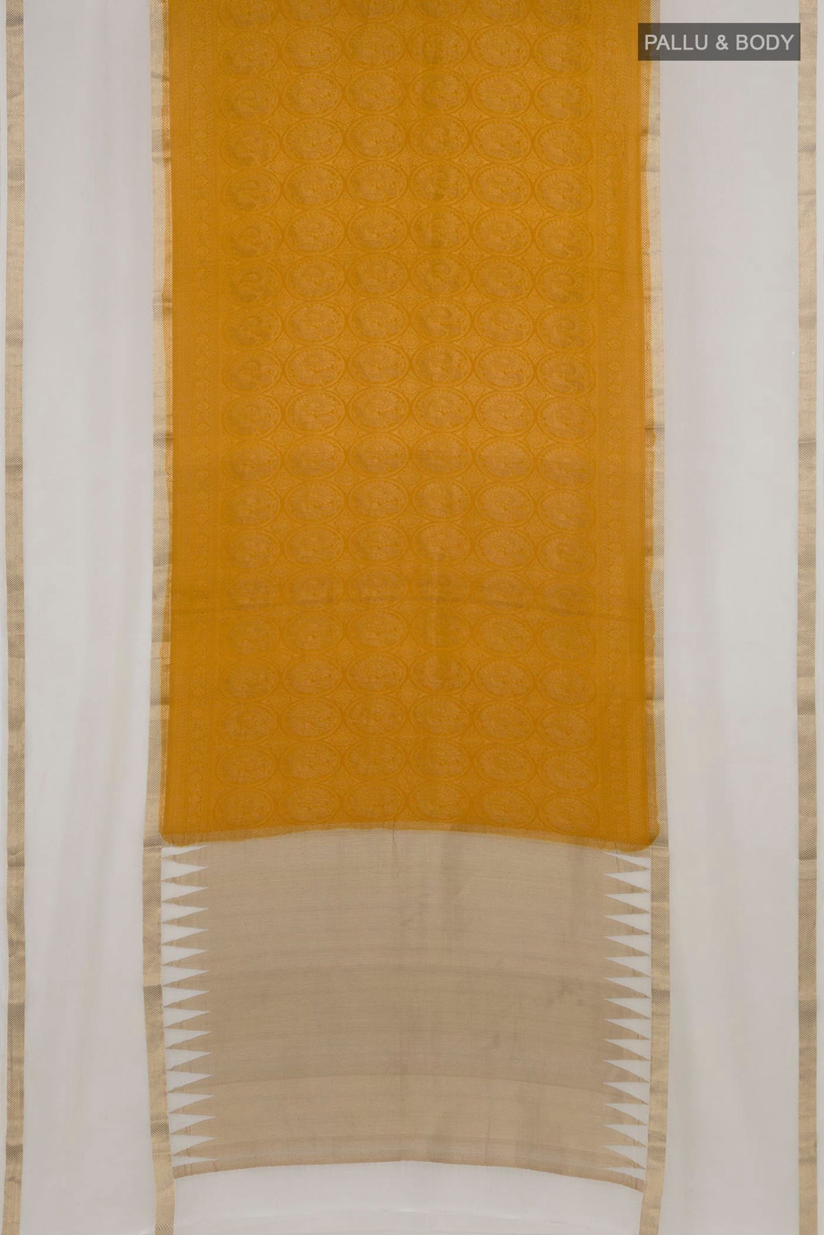 Flat view of Mustard Mysore Crepe Saree with Zari Brocade on the body and Zari Border. 