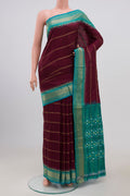 Maroon Pochampally Silk Saree with Stripes on the body and Zari Border.  displayed on a mannequin