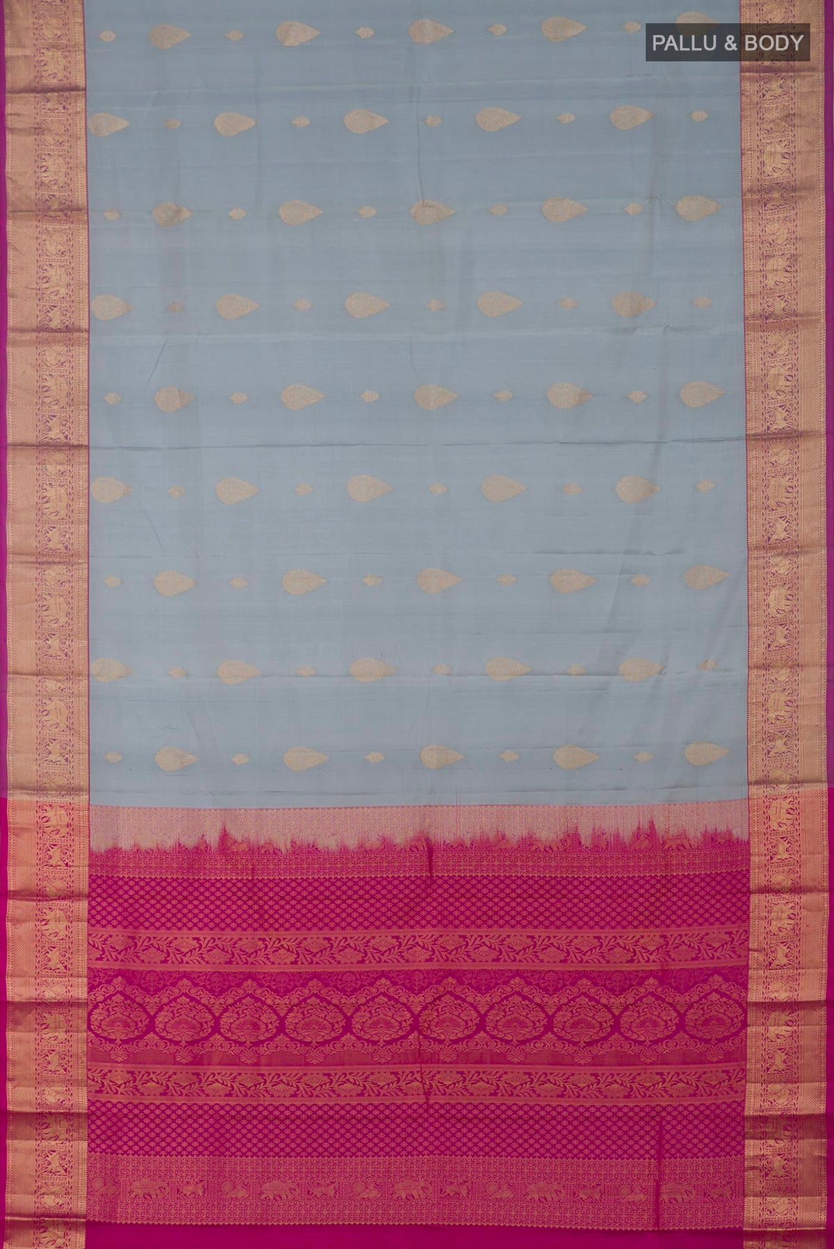 Flat view of Grey Kanjivaram Silk Saree with Zari Butta on the body and Zari Border. 