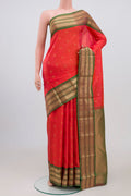 Orange Kanchipuram Saree with Zari Butta on the body and Zari Border.  displayed on a mannequin