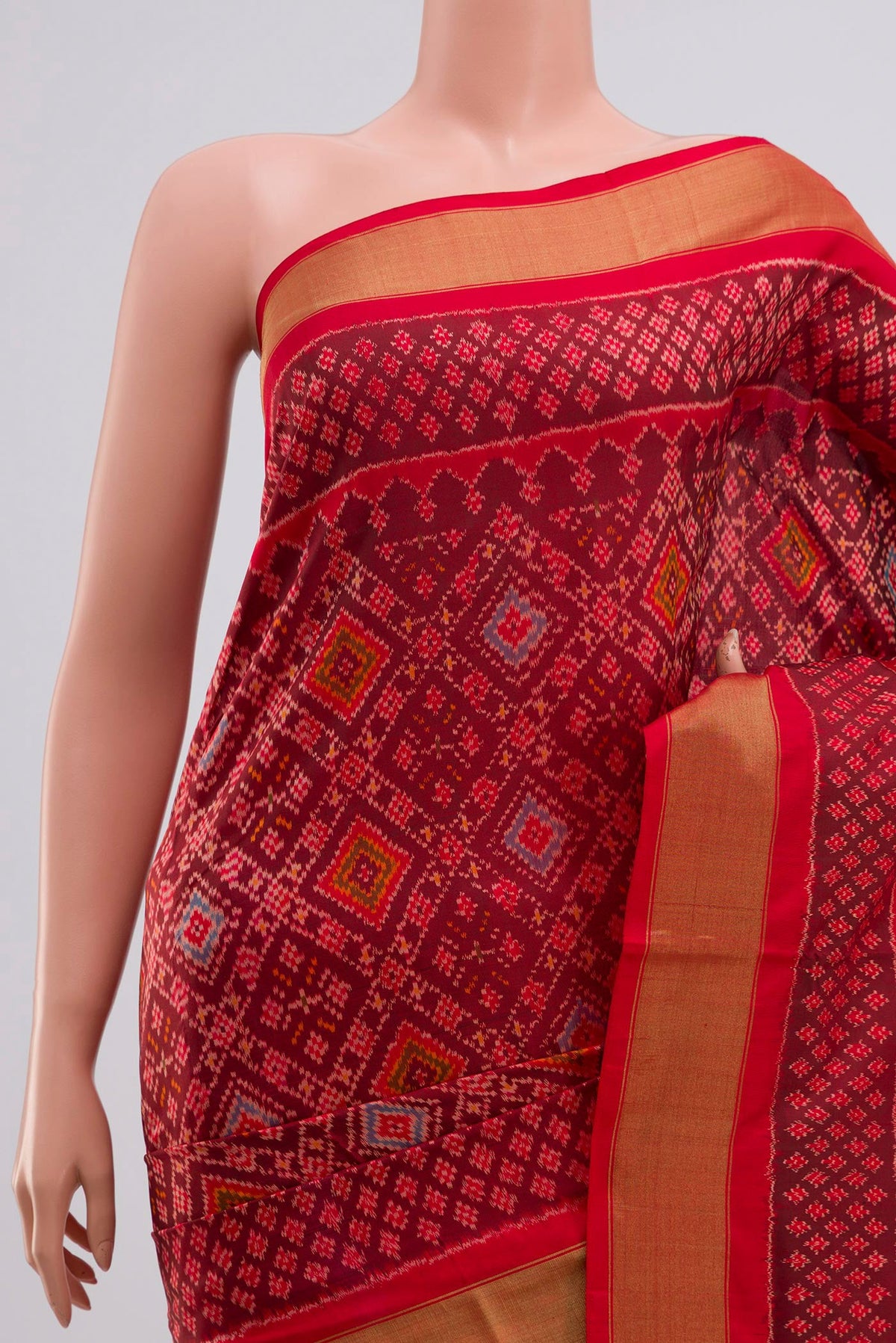 Border image of Red Pochampally Silk Saree with Ikat Print on the body and Zari Border. 