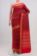 Red Pochampally Silk Saree with Ikat Print on the body and Zari Border.  displayed on a mannequin