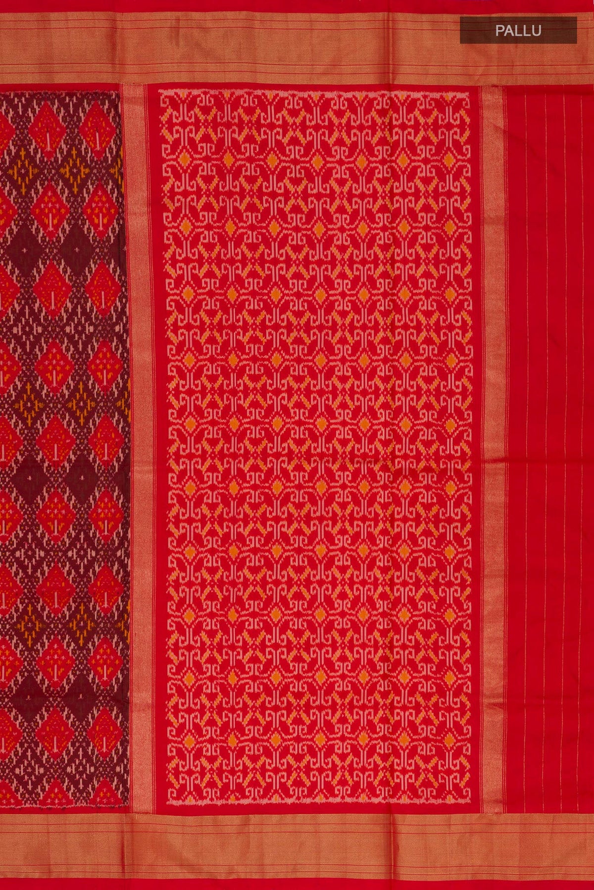 Close up image of the pallu of Orange Pochampally Silk Saree with Ikat design on the body and Zari Border. 