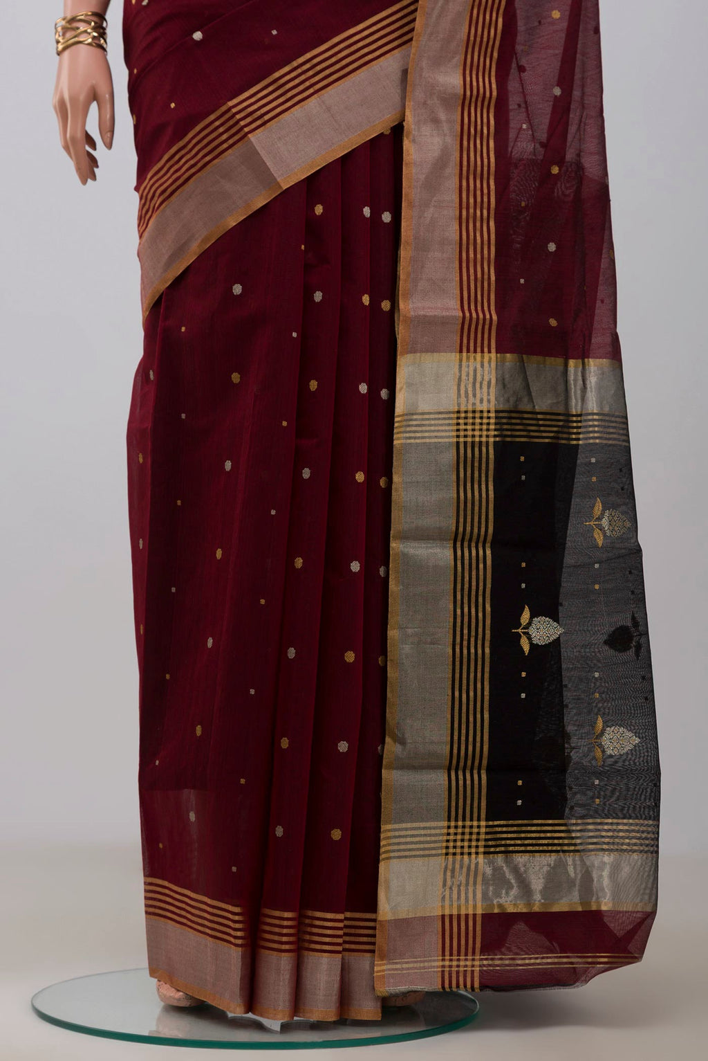 Pleats and pallu of Maroon Chanderi Silk Cotton Saree with Zari Butta on the body and Zari Border. 