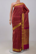 Maroon Kanjivaram Silk Saree with Jacquard With Zari Butta on the body and Zari Border.  displayed on a mannequin