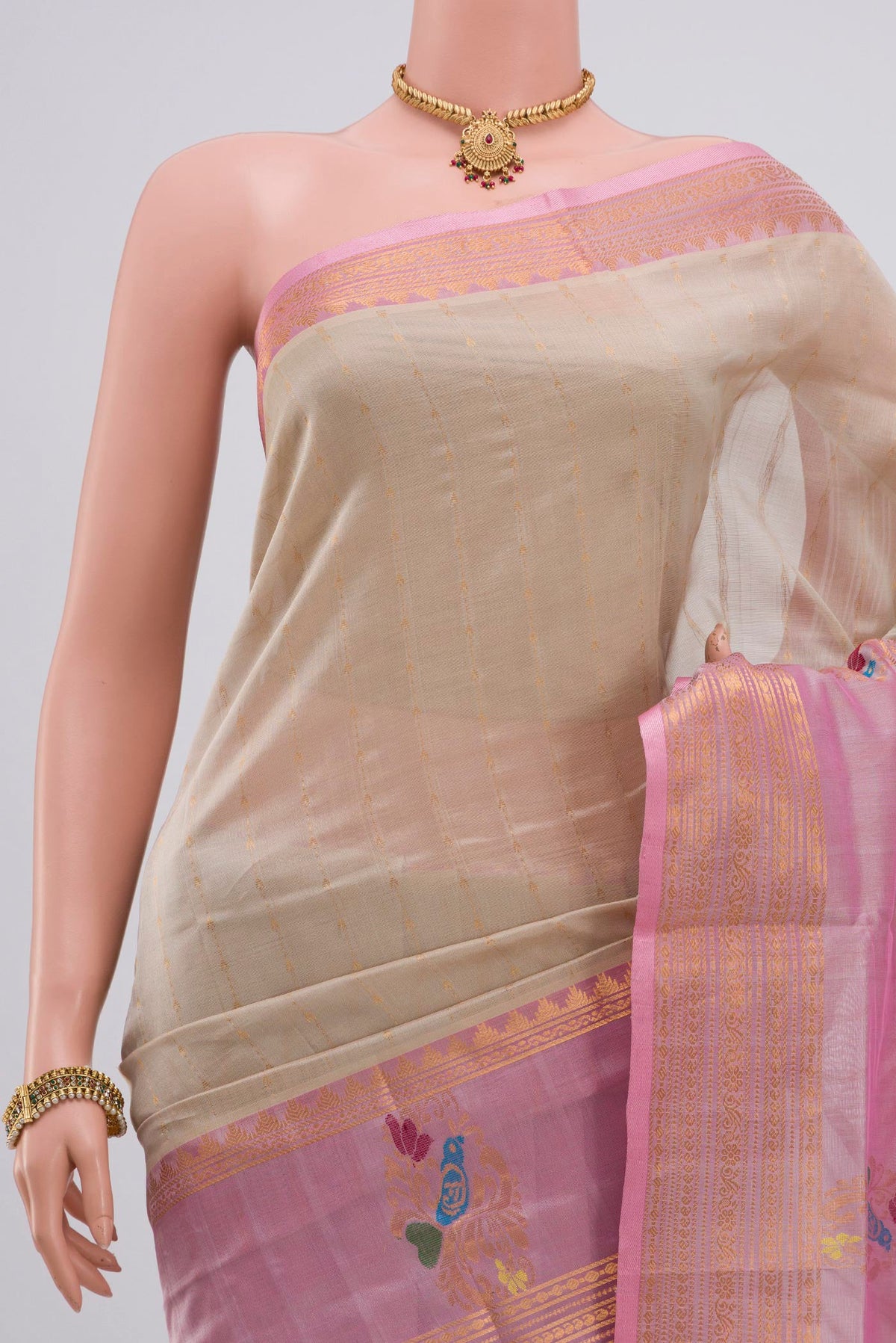 Border image of Cream Silk Cotton Saree with Stripes on the body and Zari Border. 