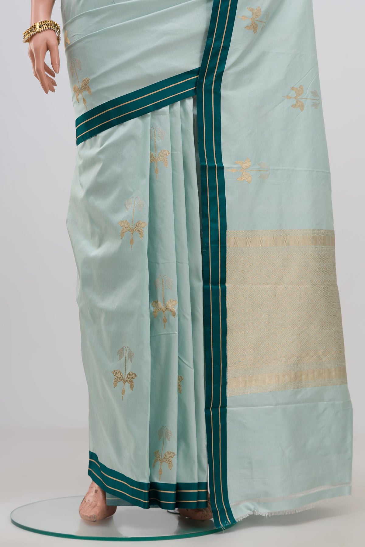 Pleats and pallu of Blue Banarasi Katan Silk Saree with Zari Butta on the body and Thin Zari Line. 