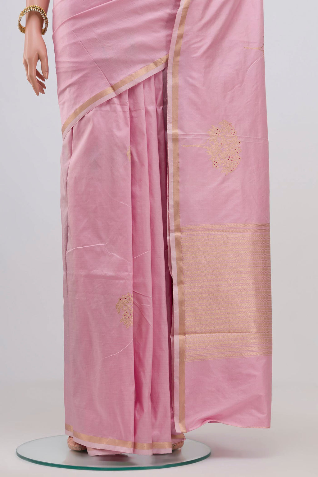 Pleats and pallu of Rose pink Banarasi Katan Silk Saree with Zari Butta on the body and Zari Border. 