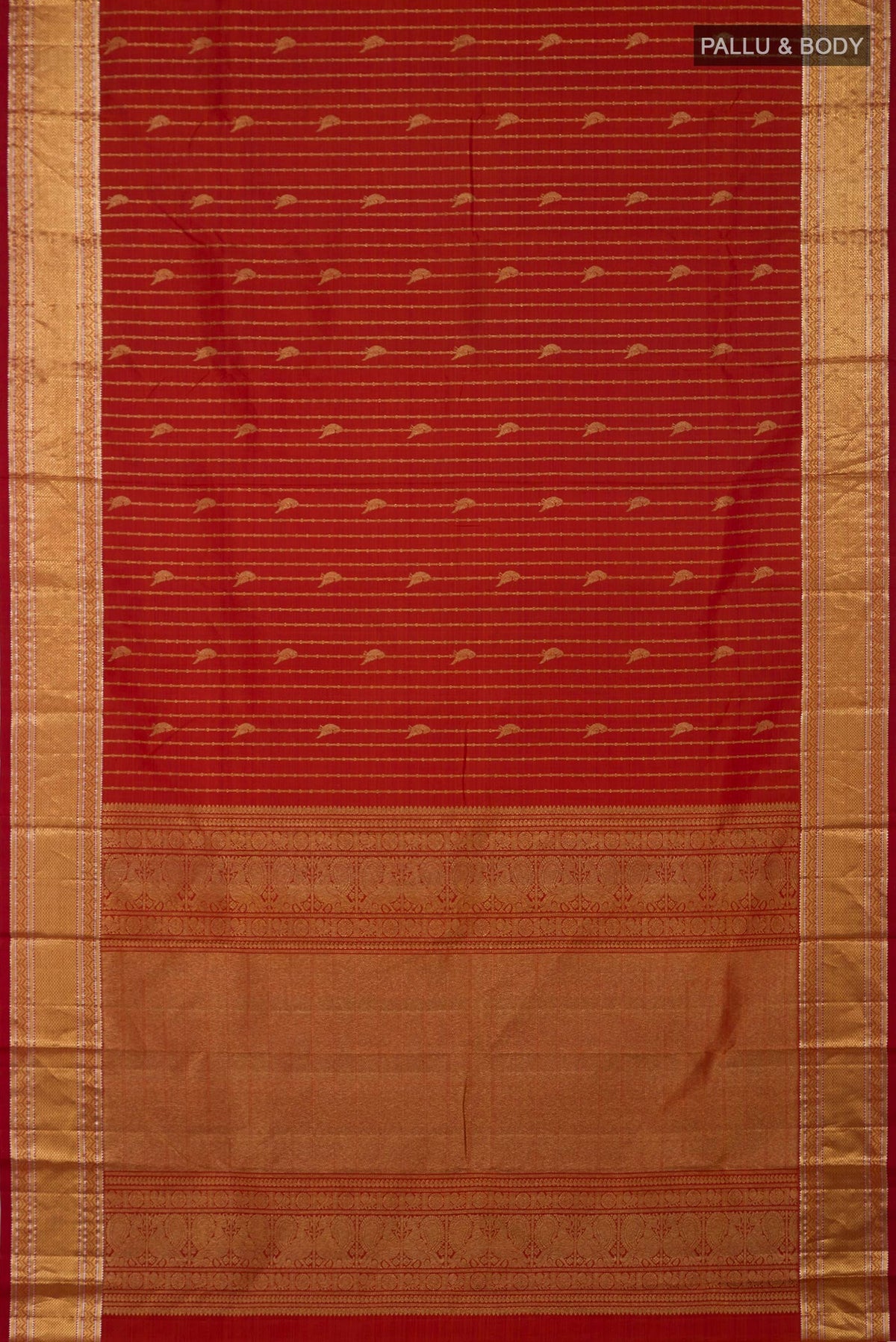 Flat view of Rust Kanchipuram Silk Saree with Stripes on the body and Zari Border. 