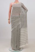 White Tussar Silk Saree with Printed design on the body and Plain Border.  displayed on a mannequin