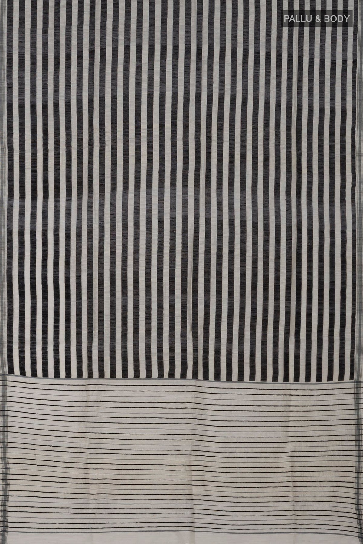 Flat view of Black Jute Silk Saree with Fancy on the body and Without Border. 