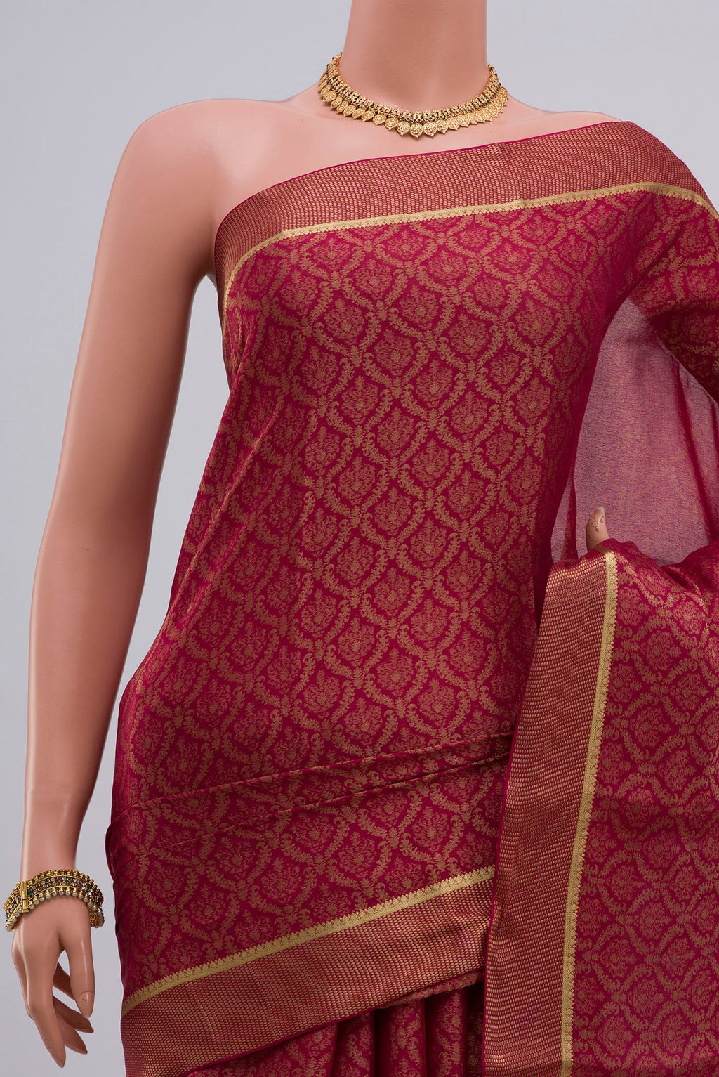 Border image of Pink Georgette Saree with Zari Brocade on the body and Zari Border. 