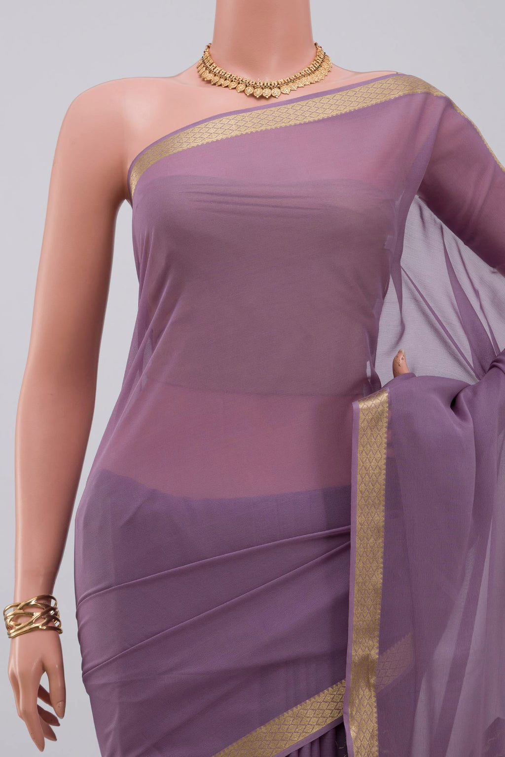 Border image of Lavender Georgette Saree with Plain Body and Zari Border. 