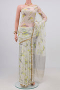Cream Chiffon Saree with Printed design on the body and Zari Border.  displayed on a mannequin