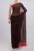 Black Chiffon Saree with Printed design on the body and Plain Border.  displayed on a mannequin