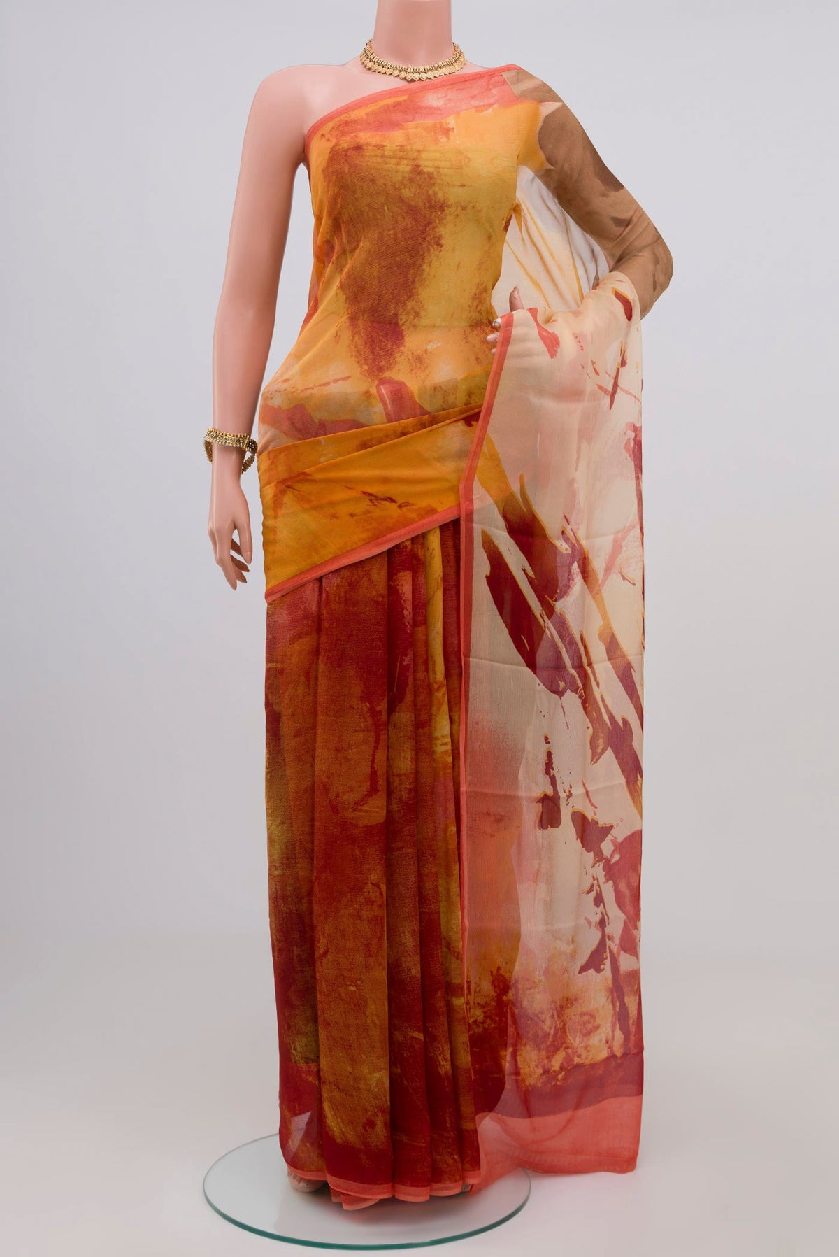 Yellow Chiffon Saree with Printed design on the body and Zari Border.  displayed on a mannequin