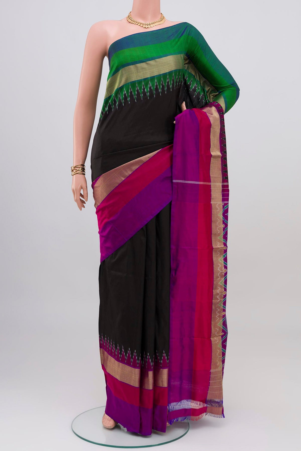 Black Pochampally Silk Saree with Plain Body and Ganga Jamuna Border.  displayed on a mannequin